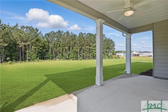106 Liam Ct, Guyton, GA 31312 - view of green lawn featuring a ceiling fan and a patio area