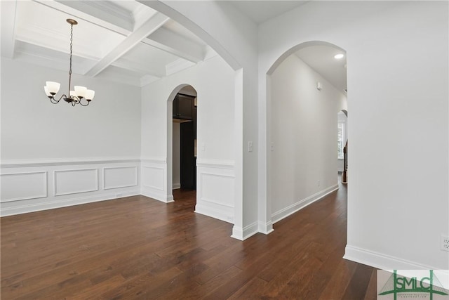 106 Liam Ct, Guyton, GA 31312 - unfurnished dining area with beam ceiling, dark wood finished floors, coffered ceiling, a chandelier, and arched walkways