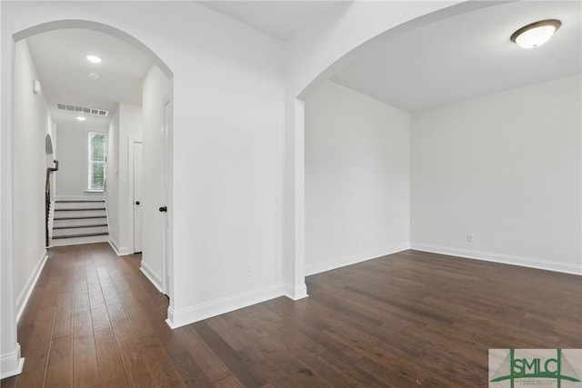 106 Liam Ct, Guyton, GA 31312 - corridor with dark wood-style floors, stairs, and baseboards
