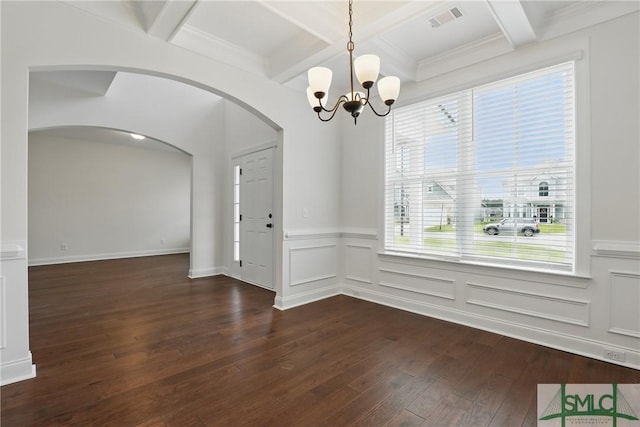 106 Liam Ct, Guyton, GA 31312 - unfurnished dining area featuring a chandelier, dark wood finished floors, coffered ceiling, arched walkways, and beamed ceiling