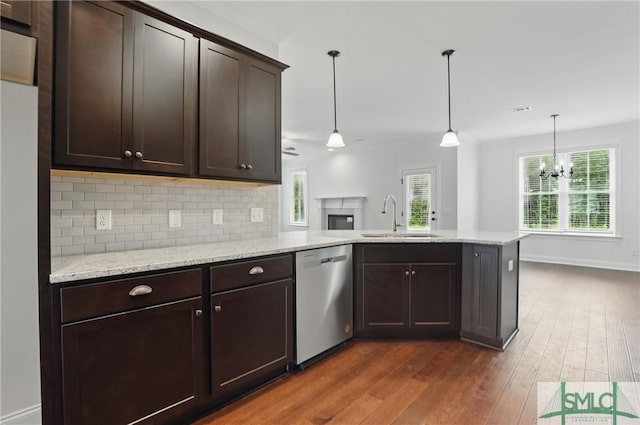 106 Liam Ct, Guyton, GA 31312 - kitchen with dishwasher, a sink, dark brown cabinetry, a peninsula, and dark wood-style floors