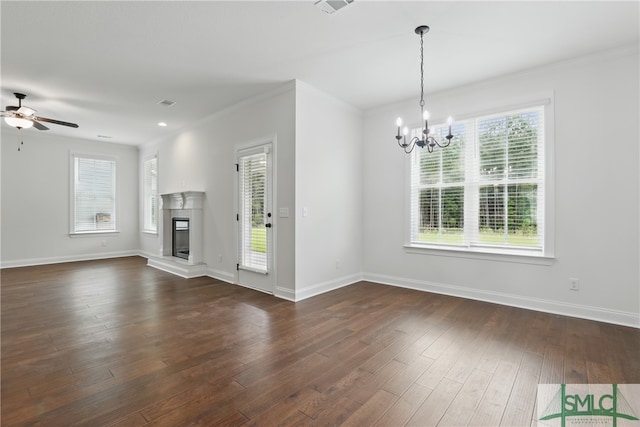 106 Liam Ct, Guyton, GA 31312 - unfurnished living room featuring a chandelier, a ceiling fan, baseboards, a glass covered fireplace, and dark wood-type flooring