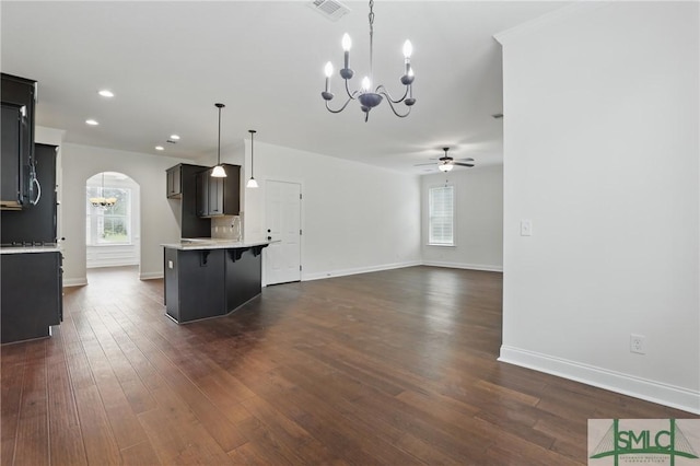 106 Liam Ct, Guyton, GA 31312 - kitchen with a chandelier, light countertops, a breakfast bar area, arched walkways, and ceiling fan
