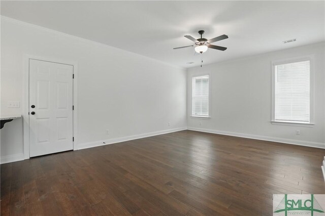 106 Liam Ct, Guyton, GA 31312 - spare room with a ceiling fan, dark wood-style floors, baseboards, and crown molding