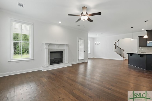 106 Liam Ct, Guyton, GA 31312 - unfurnished living room featuring ceiling fan, a glass covered fireplace, dark wood-style flooring, baseboards, and recessed lighting
