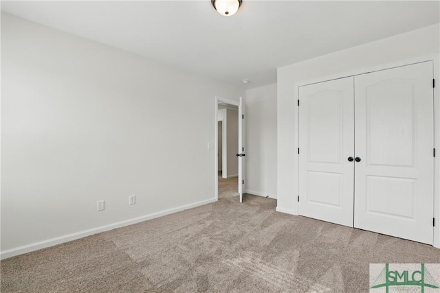 106 Liam Ct, Guyton, GA 31312 - unfurnished bedroom with carpet floors, a closet, and baseboards