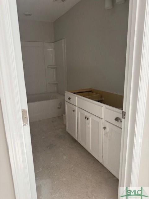 bathroom featuring visible vents, shower / bathing tub combination, and vanity