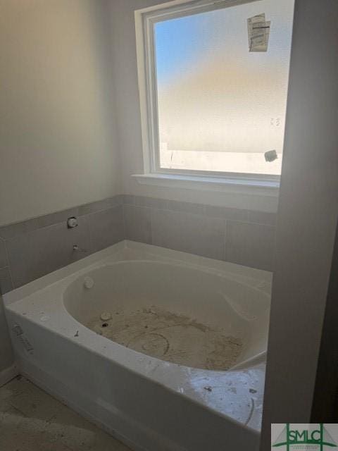 full bath featuring a bath