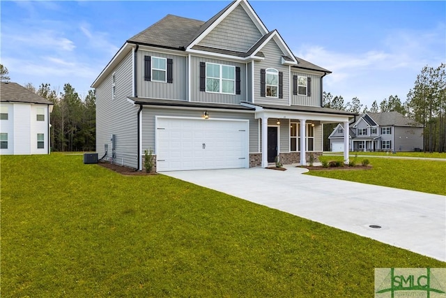 craftsman inspired home featuring a garage, driveway, board and batten siding, and a front lawn