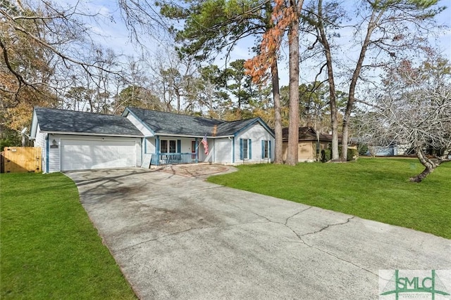 ranch-style house featuring a front yard, a garage, and a porch