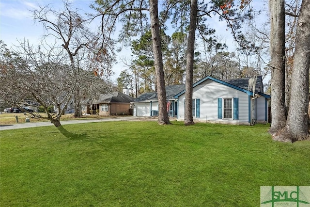 ranch-style home with a front yard and a garage