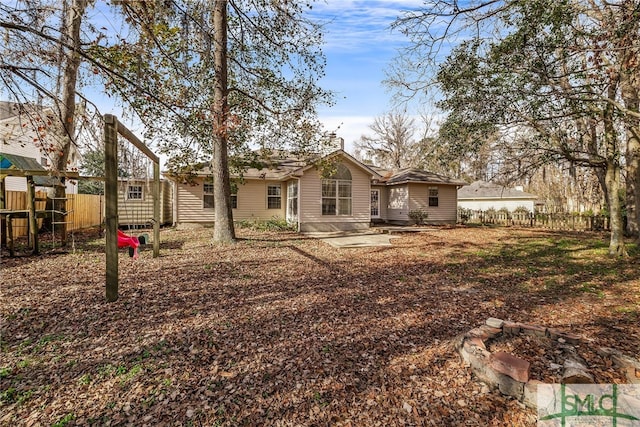 back of house with a patio