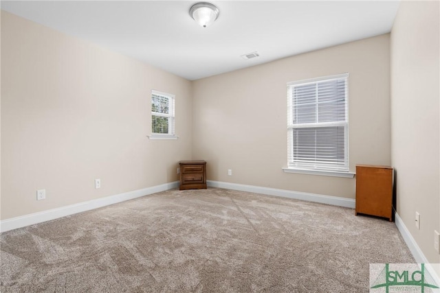 unfurnished room with carpet floors