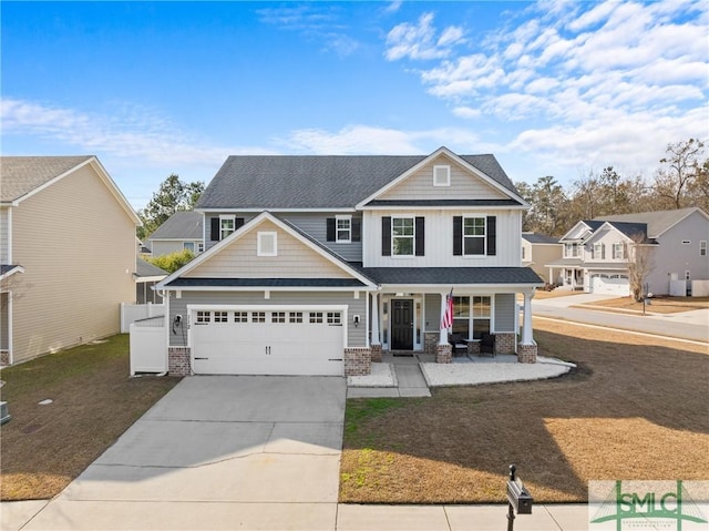 view of front of property featuring a garage and covered porch