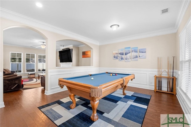 game room featuring dark hardwood / wood-style flooring, crown molding, and ceiling fan