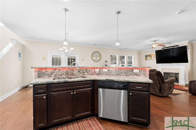 kitchen featuring hanging light fixtures, dishwasher, dark brown cabinets, and sink