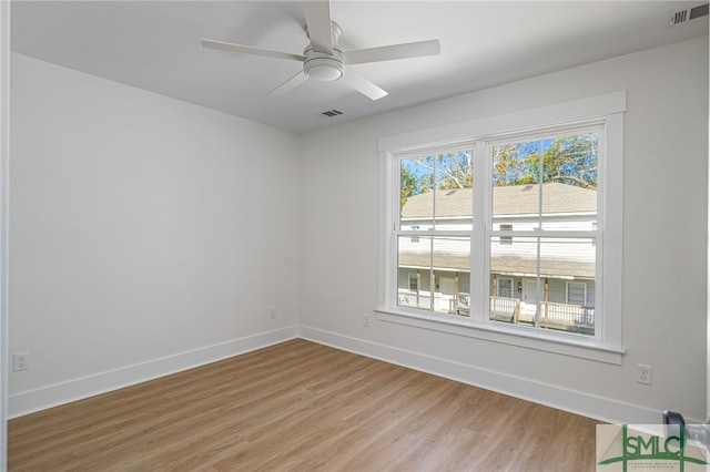 spare room featuring ceiling fan and light wood-type flooring