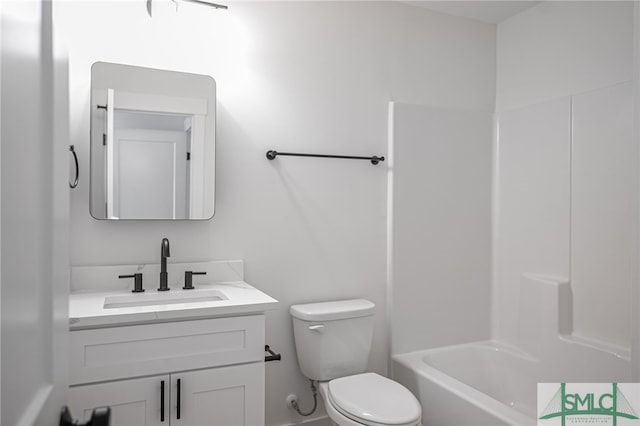 full bathroom with vanity, tub / shower combination, and toilet