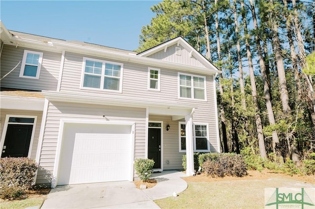 townhome / multi-family property featuring a garage