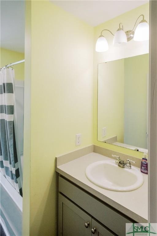 bathroom with vanity and walk in shower