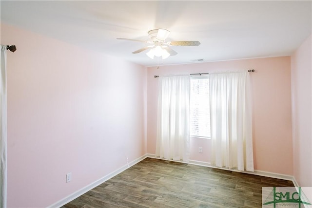 spare room featuring ceiling fan and wood-type flooring