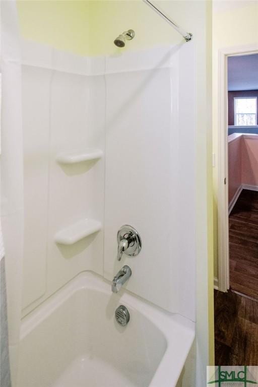 bathroom featuring  shower combination