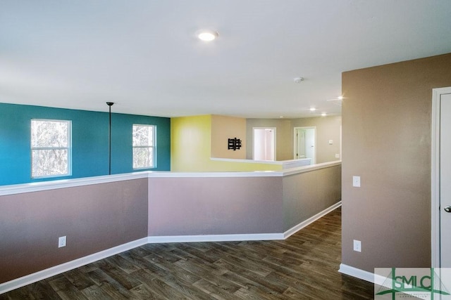 hallway featuring dark wood-type flooring