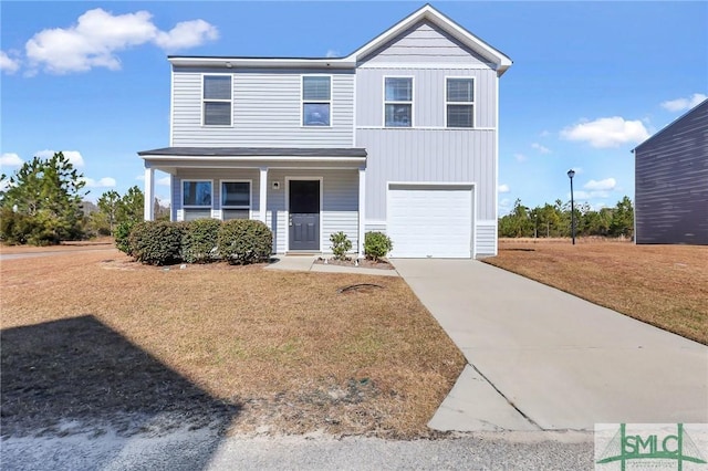 view of front property with a front lawn, covered porch, and a garage