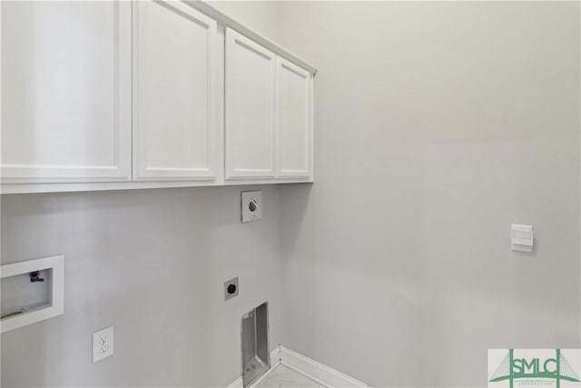 clothes washing area with hookup for a washing machine, cabinets, and hookup for an electric dryer