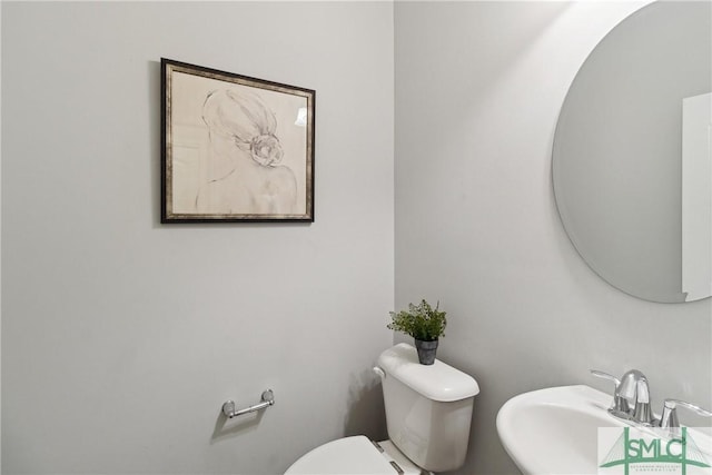 bathroom with sink and toilet