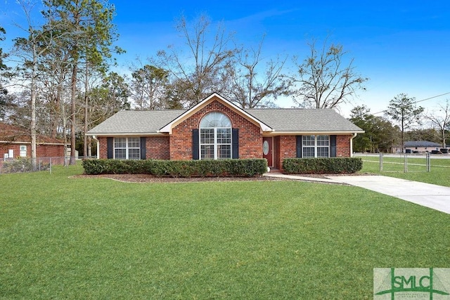 ranch-style home with a front yard