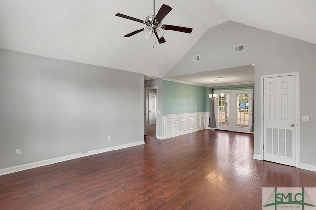 unfurnished living room featuring ceiling fan with notable chandelier, dark hardwood / wood-style floors, and high vaulted ceiling