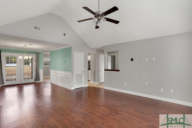 unfurnished living room with dark wood-type flooring, lofted ceiling, and ceiling fan with notable chandelier