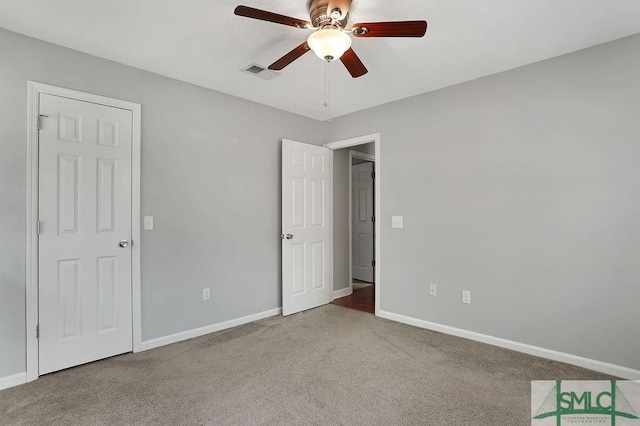 unfurnished bedroom with light carpet and ceiling fan