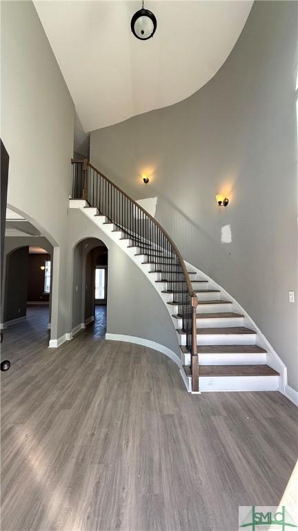 stairs with hardwood / wood-style flooring