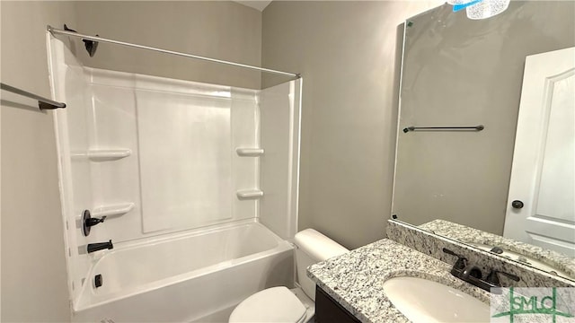 full bathroom featuring toilet, vanity, and shower / bathing tub combination