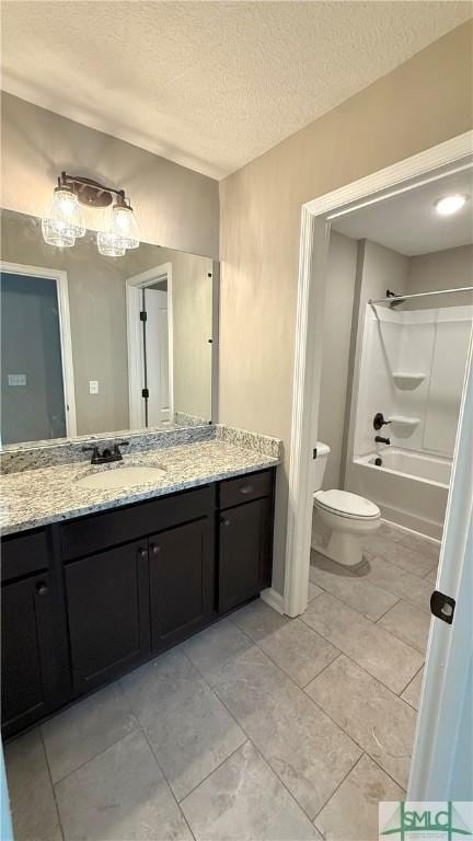 full bathroom with toilet, vanity,  shower combination, and a textured ceiling