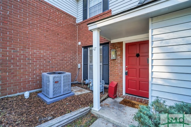 entrance to property featuring central air condition unit