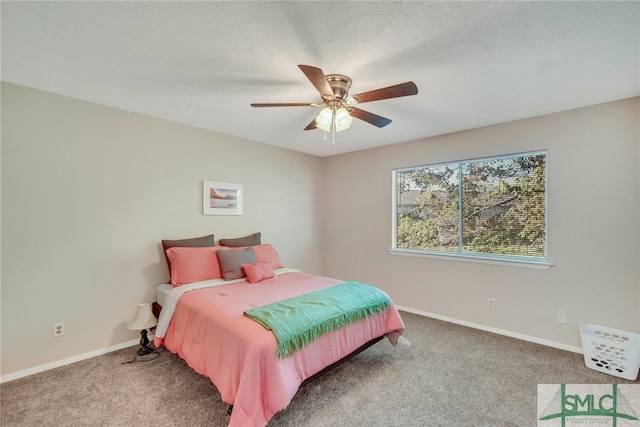 bedroom featuring ceiling fan and carpet