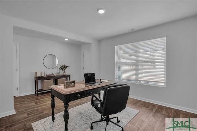 home office with hardwood / wood-style flooring