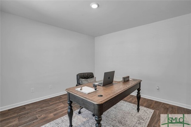 office space with dark wood-type flooring