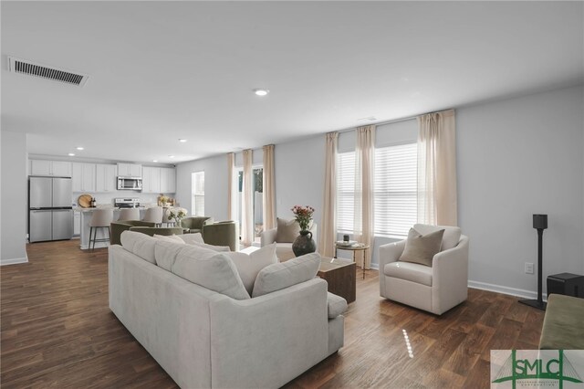 living room with dark hardwood / wood-style floors