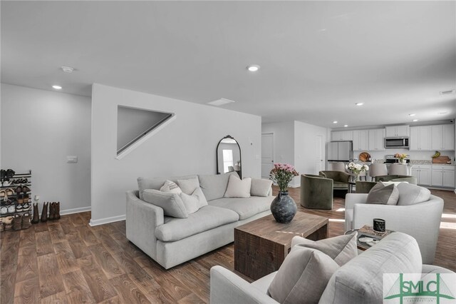 living room featuring dark hardwood / wood-style floors