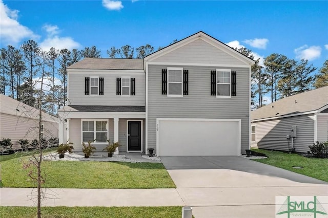 view of front of house with a garage and a front lawn