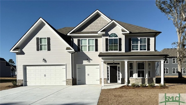 view of front of home featuring a garage and a porch