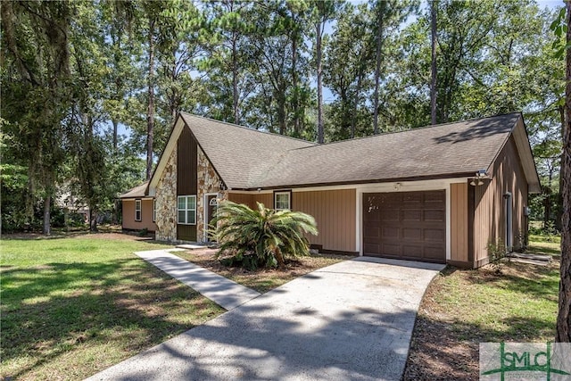 view of front of home featuring a garage and a front lawn