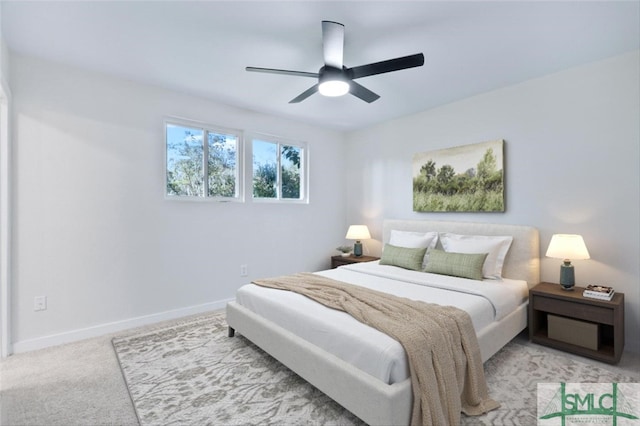 bedroom featuring ceiling fan and light colored carpet