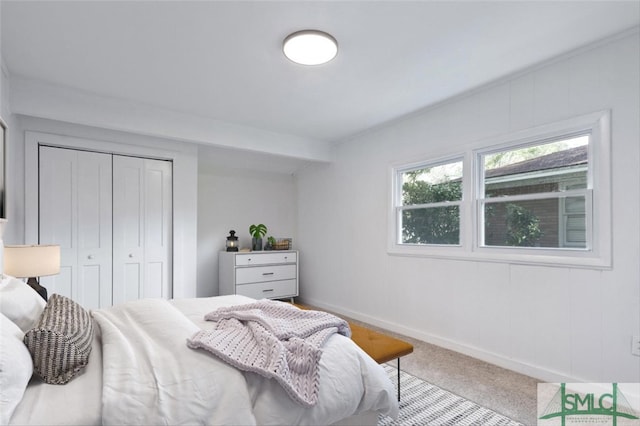 carpeted bedroom with a closet