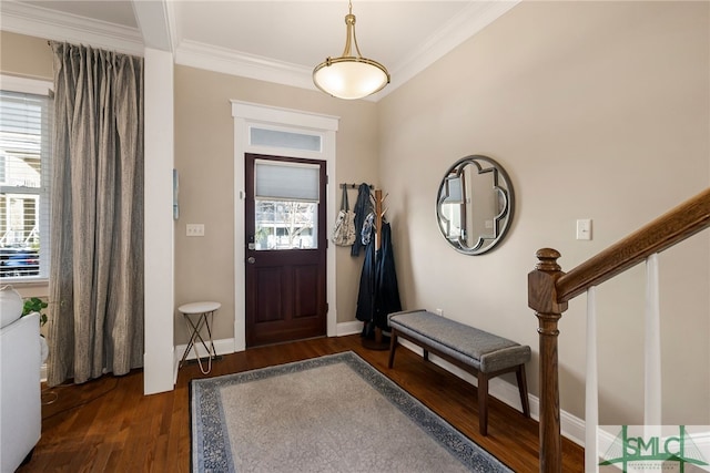 entrance foyer with dark wood-type flooring and crown molding