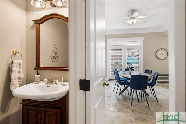 bathroom featuring ceiling fan and vanity